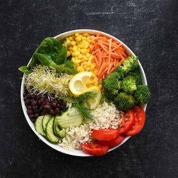 A colorful bowl of quinoa salad with beans and veggies